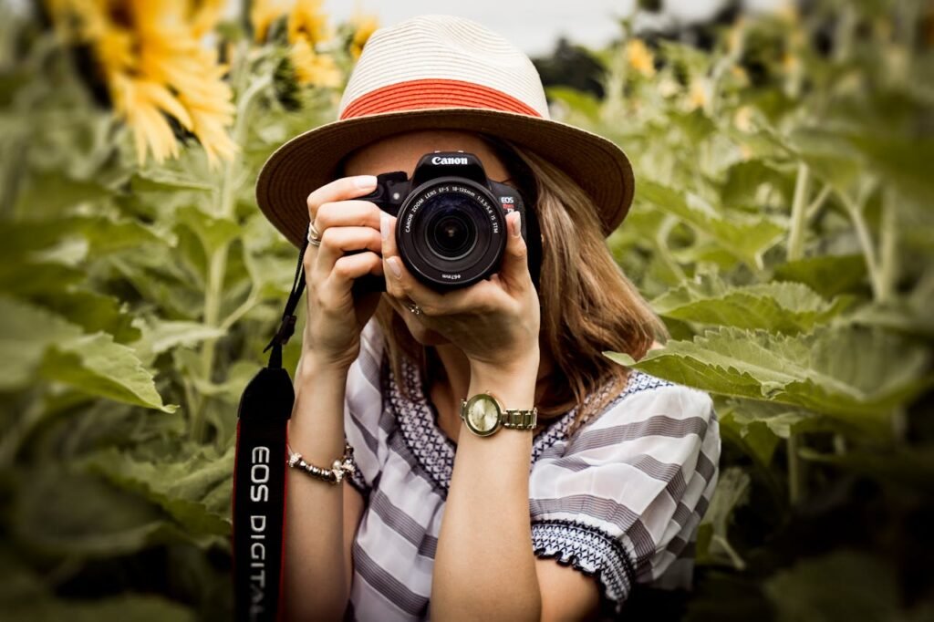 Selective Focus Photography of Woman Holding Dslr Camera
